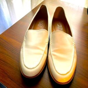 Franco Sarto slip on white patent leather loafer with silver accents on heels
